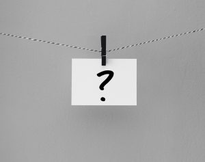 The pic for the FAQ's page is a black and white string, with a black wooden clothespin hanging from it, holding an index card with a question mark on it. The picture equivalent of "Whaaa?!"