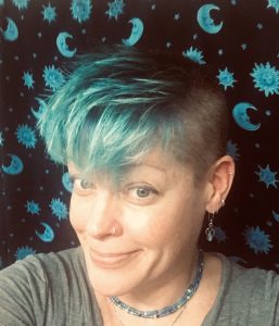 Me. Punk rock crew cut, brushed forward, and 3 hues of blue. In front of a moon and stars sarong of the same hues.