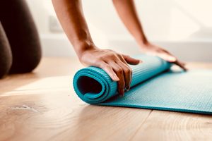 Unrolling a blue yoga mat... and a world of possibilities